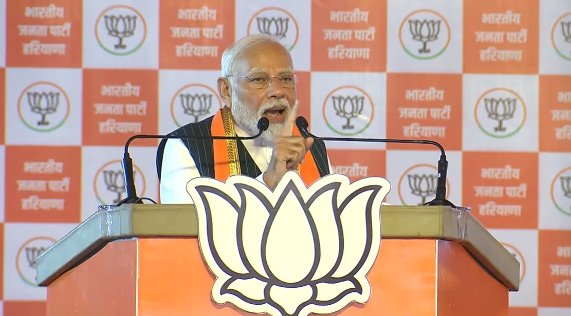 Prime Minister Narendra Modi at an election rally in Kurukshetra, Haryana, addressing the crowd and criticizing the Congress party over appeasement politics and the Ganesh idol controversy in Karnataka.