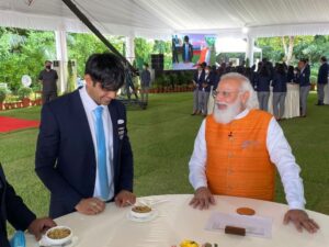 Prime Minister Narendra Modi and Neeraj Chopra's Mother, Saroj Devi, with churma.